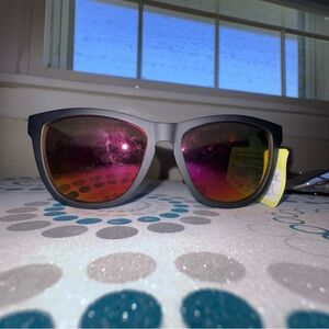 Stylish Black Sunglasses
Orange Red Lenses
Classic wafer style 
MSRP $20